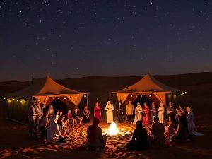 People enjoying cultural performances at a desert safari camp in Dubai at night